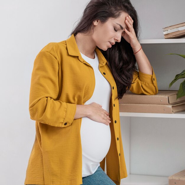 Pregnant woman at home not feeling very well