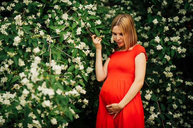 Pregnant woman looking down medium shot