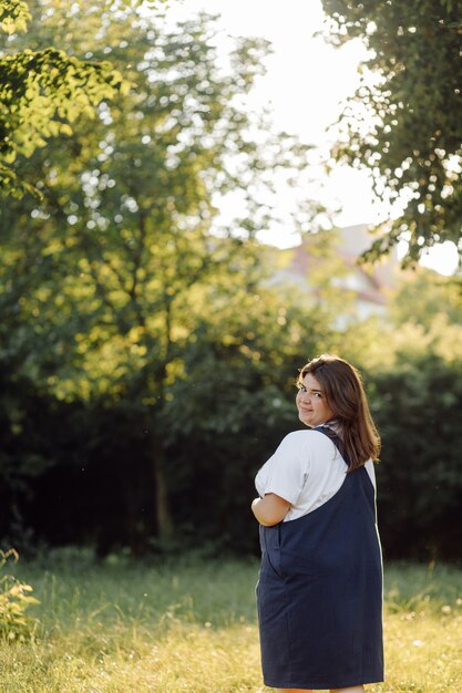 Pregnant woman posing in the park