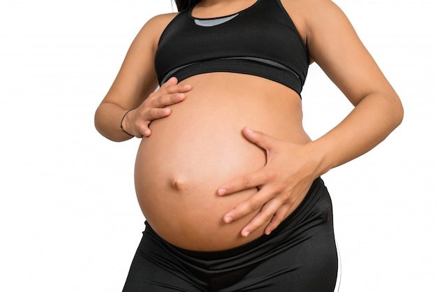 Free photo pregnant woman touching her big belly.