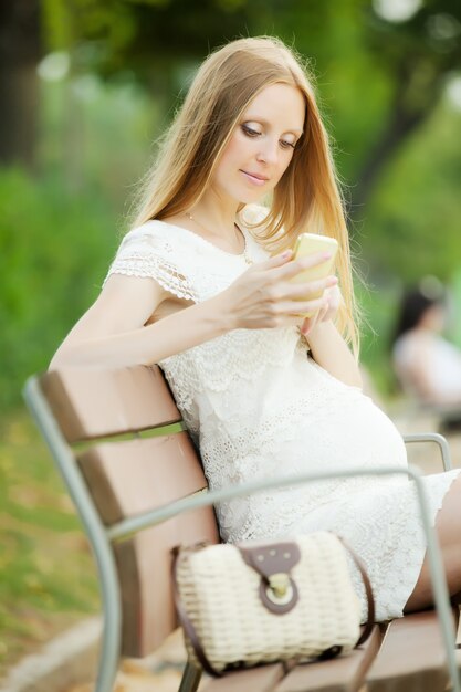 pregnant woman using mobile