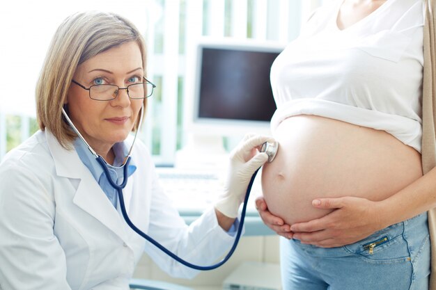 Pregnant woman visiting doctor