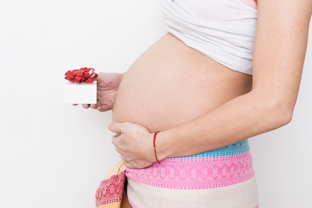 Pregnant woman with present