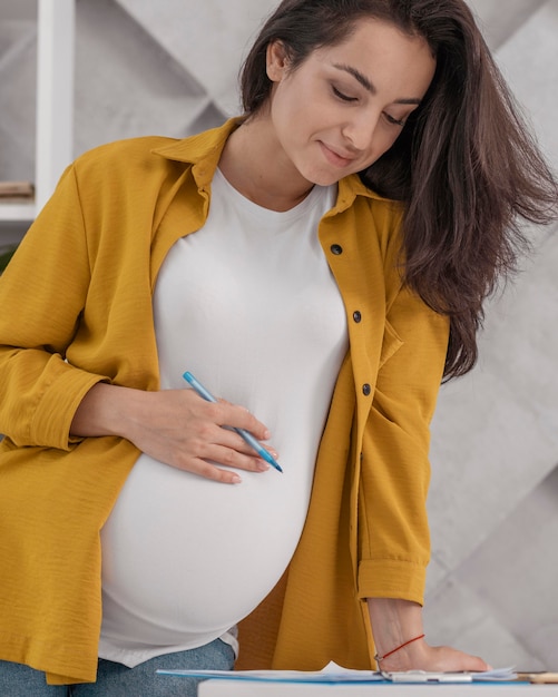 Pregnant woman working from home