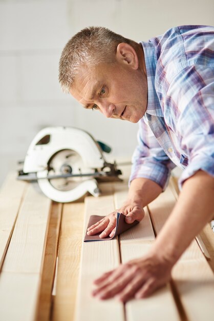 Preparation of wooden planks by carpenter