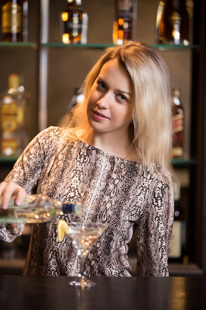 Preparing alcohol drink at bar counter