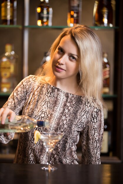 Preparing alcohol drink at bar counter