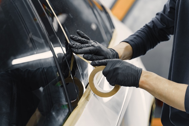 Preparing a car before spray painting