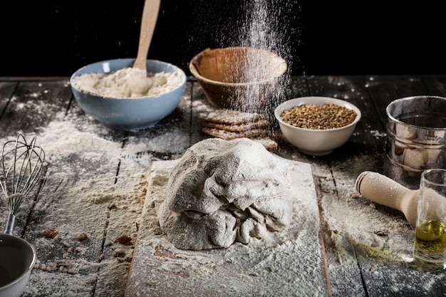 Preparing the dough with flour over the table