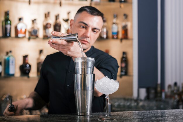 Preparing a refreshing cocktail in a bar