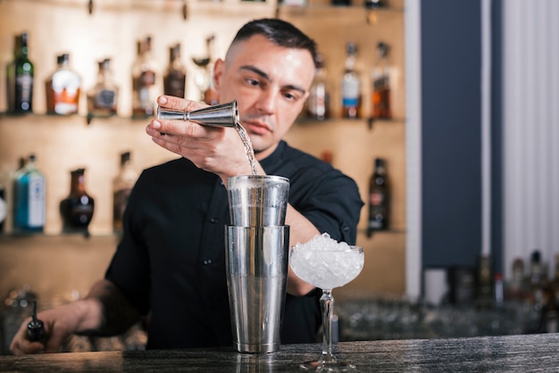 Preparing a refreshing cocktail in a bar