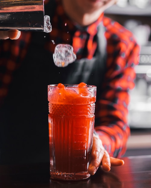 Preparing a refreshing cocktail in a bar