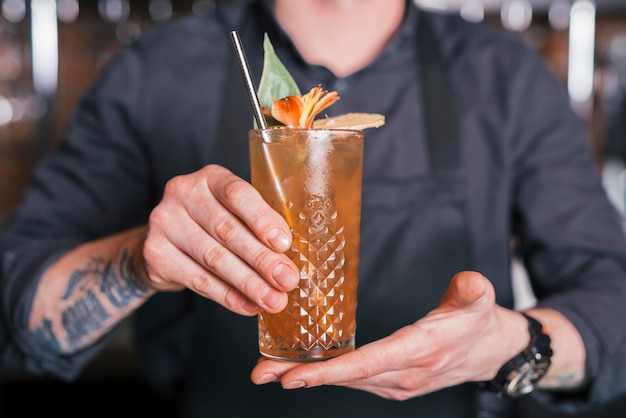 Preparing a refreshing cocktail in a bar