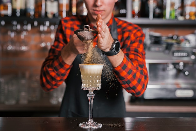 Preparing a refreshing cocktail in a bar