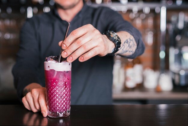 Preparing a refreshing cocktail in a bar