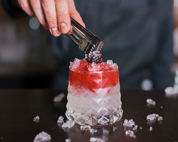 Preparing a refreshing cocktail in a bar