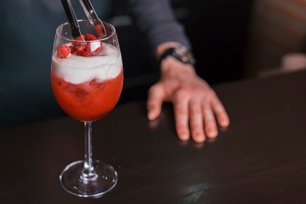 Preparing a refreshing cocktail in a bar