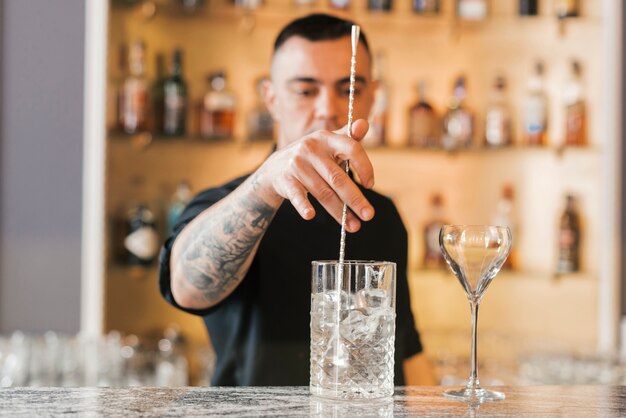 Preparing a refreshing cocktail in a bar