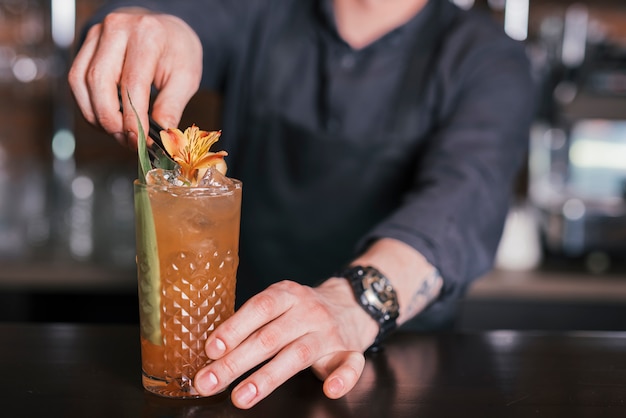 Preparing a refreshing cocktail in a bar