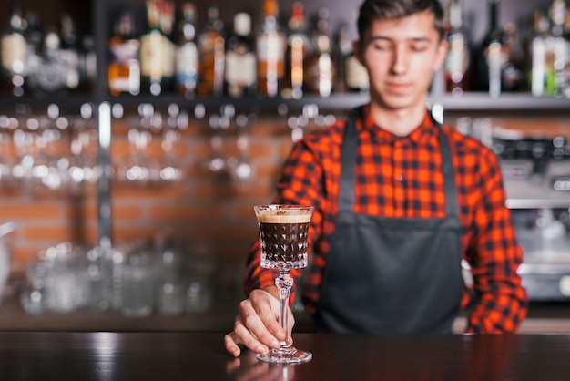 Preparing a refreshing cocktail in a bar