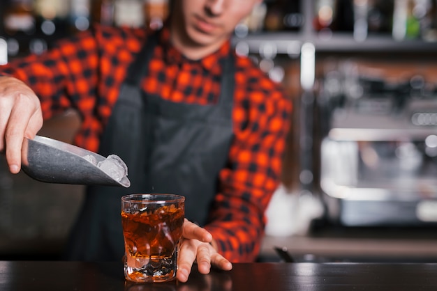 Preparing a refreshing cocktail in a bar