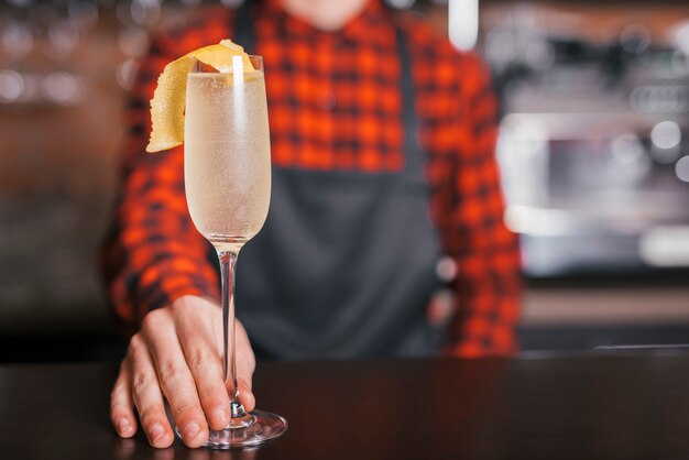 Preparing a refreshing cocktail in a bar