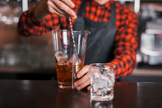 Preparing a refreshing cocktail in a bar