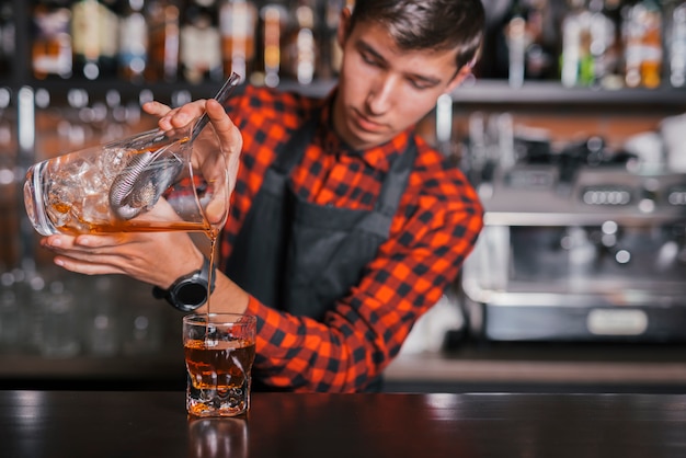 Preparing a refreshing cocktail in a bar