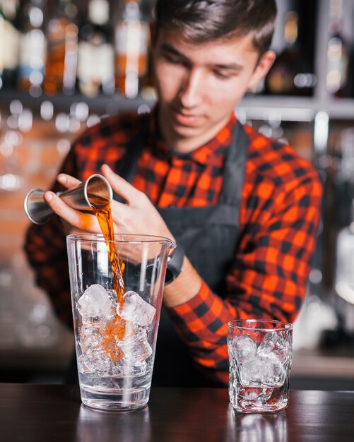 Preparing a refreshing cocktail in a bar