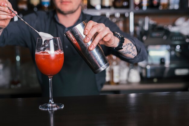 Preparing a refreshing cocktail in a bar
