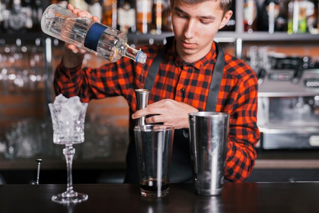 Preparing a refreshing cocktail in a bar