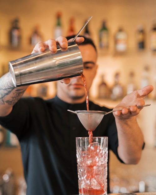 Preparing a refreshing cocktail in a bar