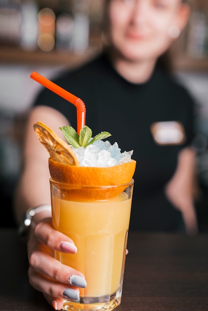 Preparing a refreshing cocktail in a bar