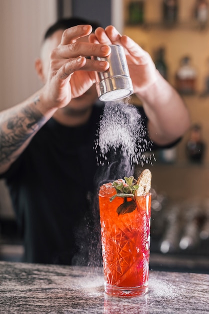 Preparing a refreshing cocktail in a bar