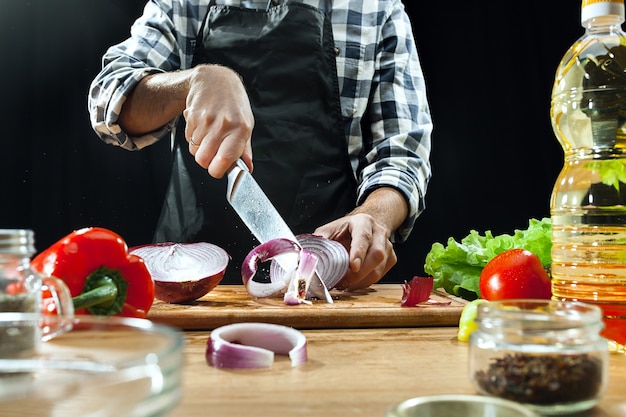 Preparing salad. Female chef cutting fresh vegetables. Cooking process. Selective focus. The healthy food, kitchen, salad, diet, cuisine organic concept