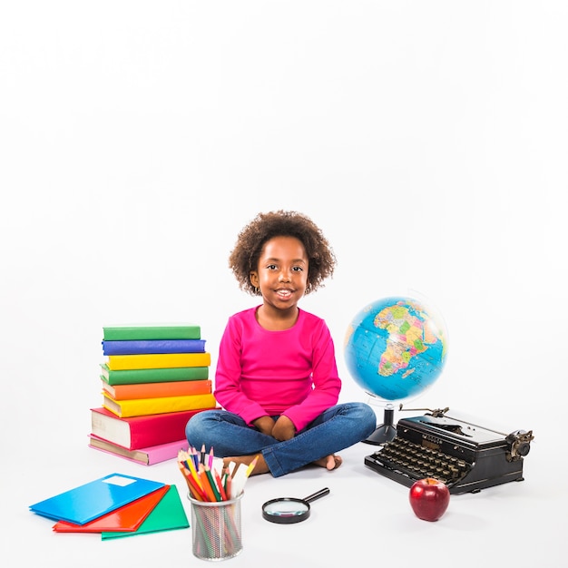 Free photo preschooler with with educational tools in studio