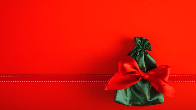 Present bag with red bow 