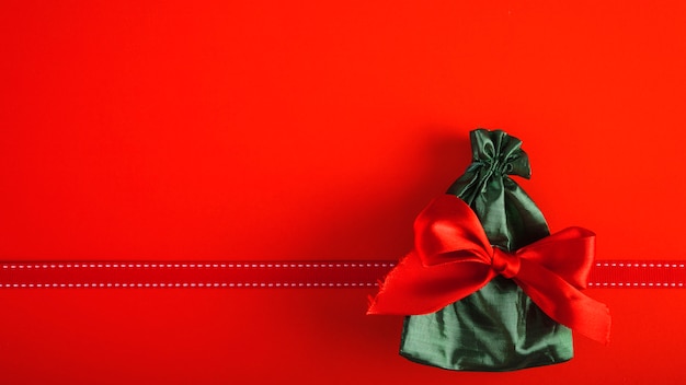 Present bag with red bow 