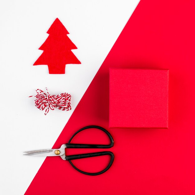 Present box near scissors and thread 