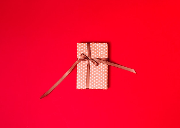 Present box in sweetie paper with ribbon