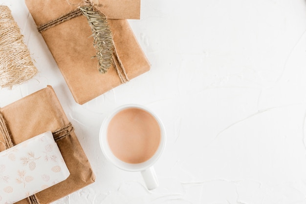 Present boxes near cup and fir twig 