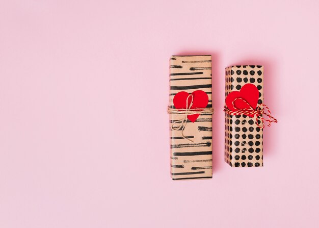 Present boxes in wraps with decorative hearts 