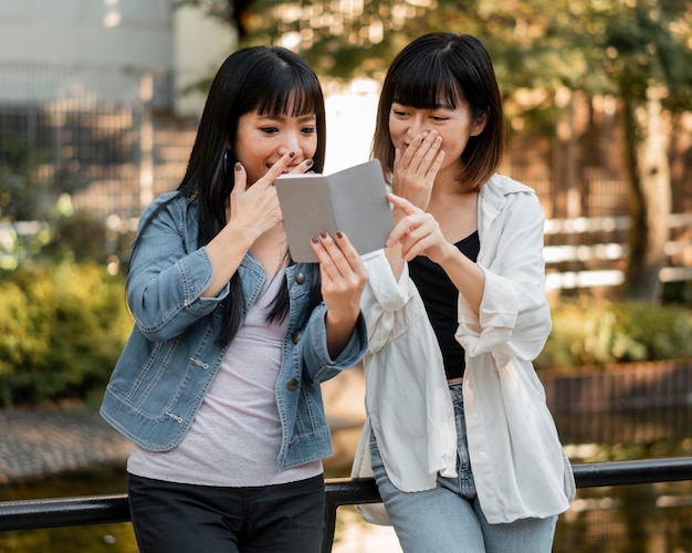 Pretty asian girls having fun together