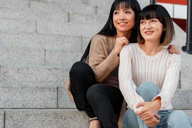 pretty asian girls posing together