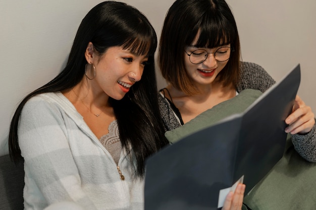 Pretty asian girls reading together