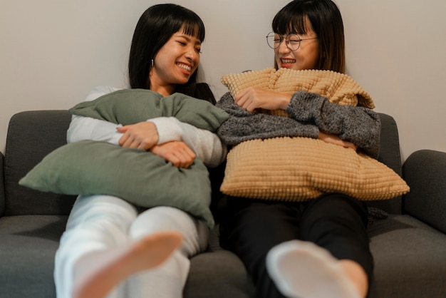 Free photo pretty asian girls relaxing at home