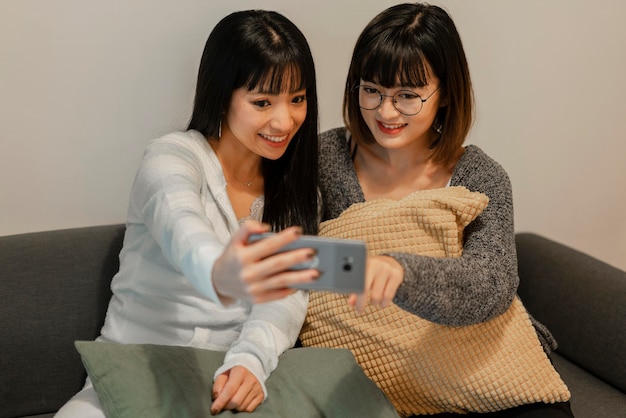Pretty asian girls taking a selfie