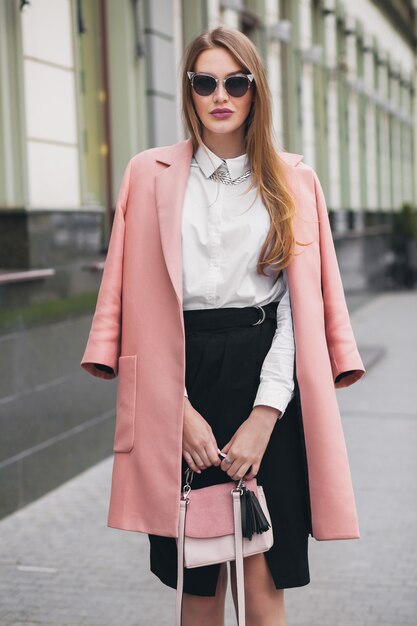 Pretty attractive stylish smiling rich woman walking city street in pink coat