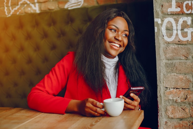 pretty black girl in a cafe