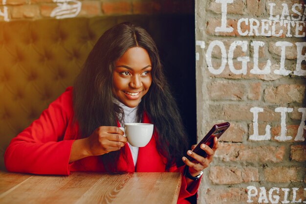 pretty black girl in a cafe